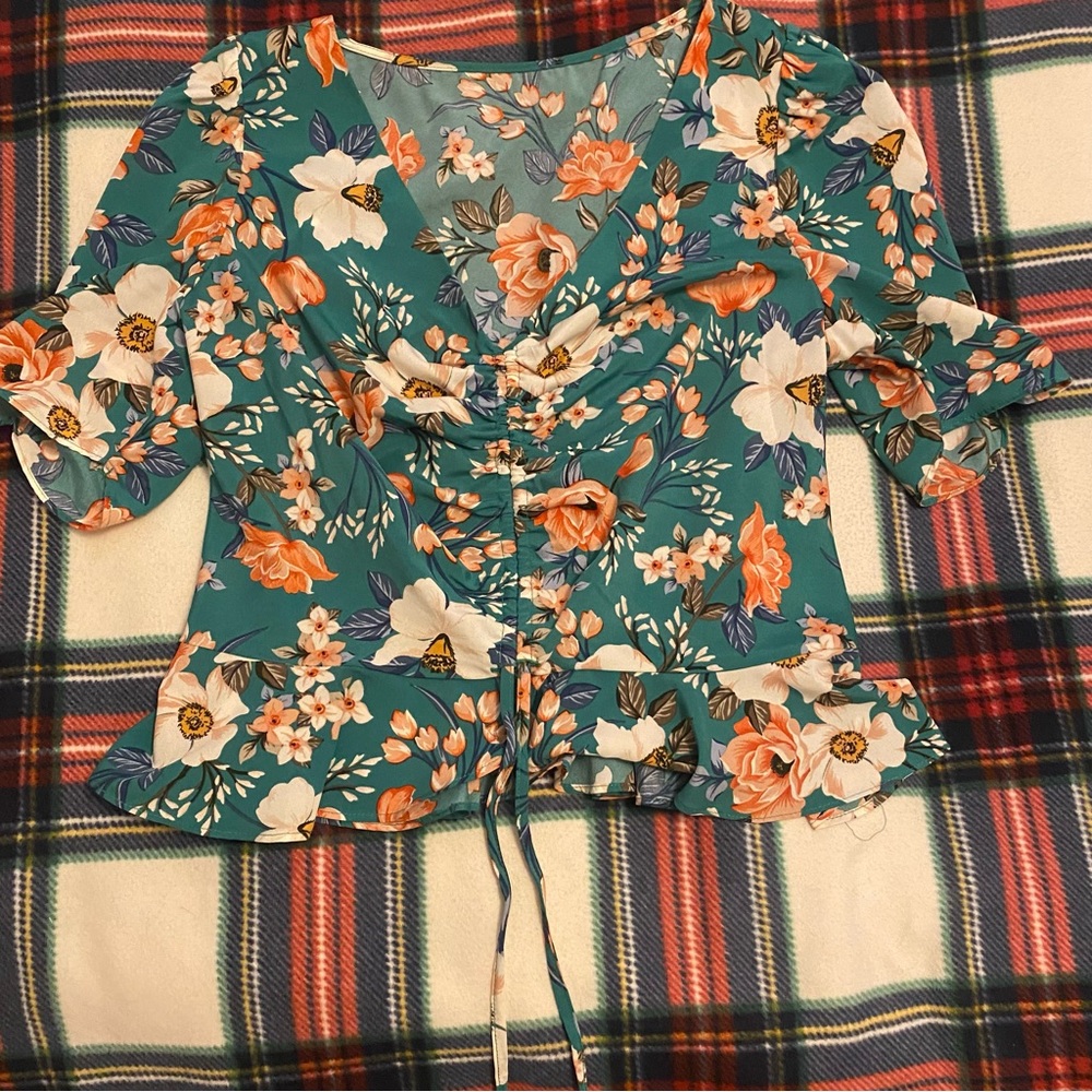 Green floral top with adjustable strings in the front